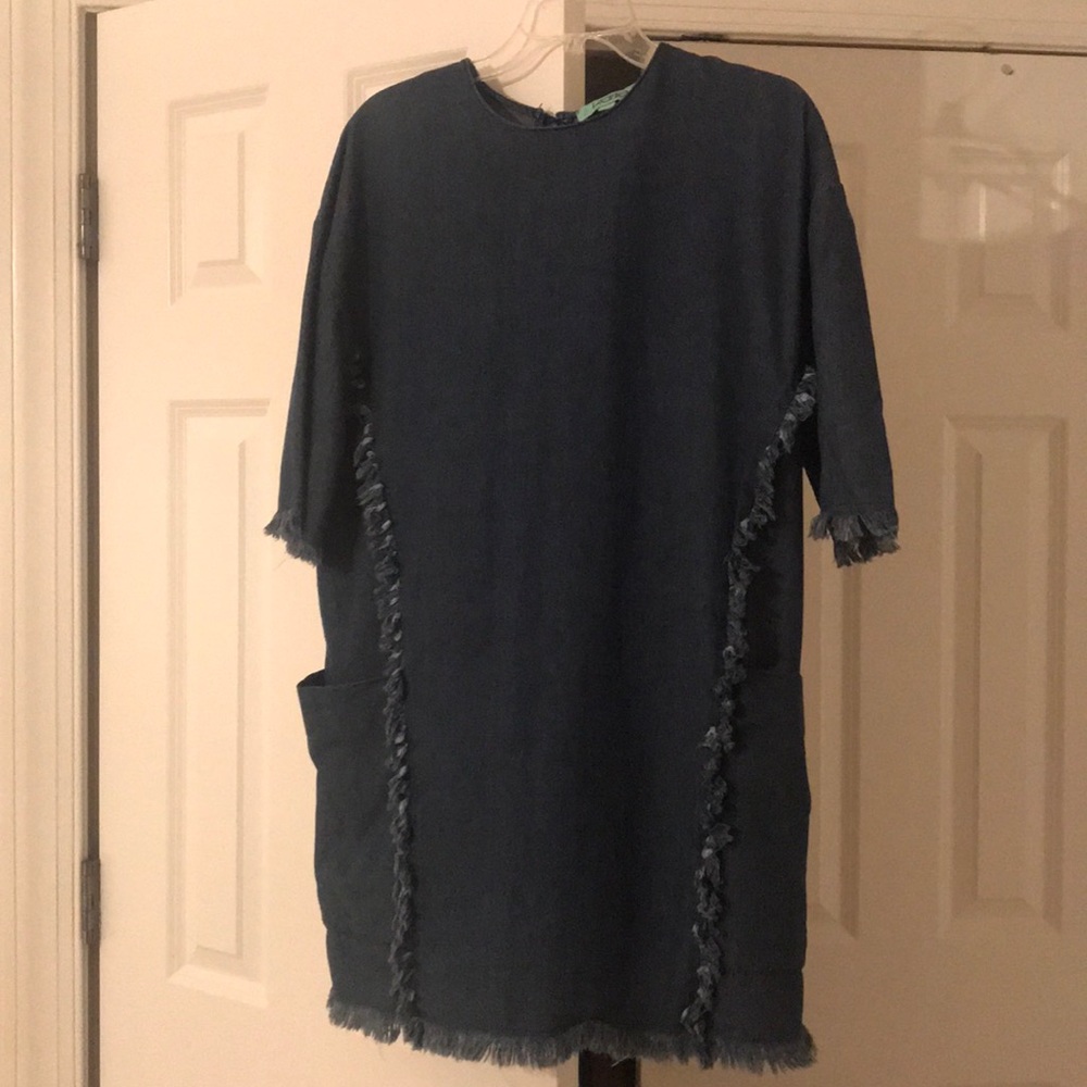 A denim dress with quarter length sleeves